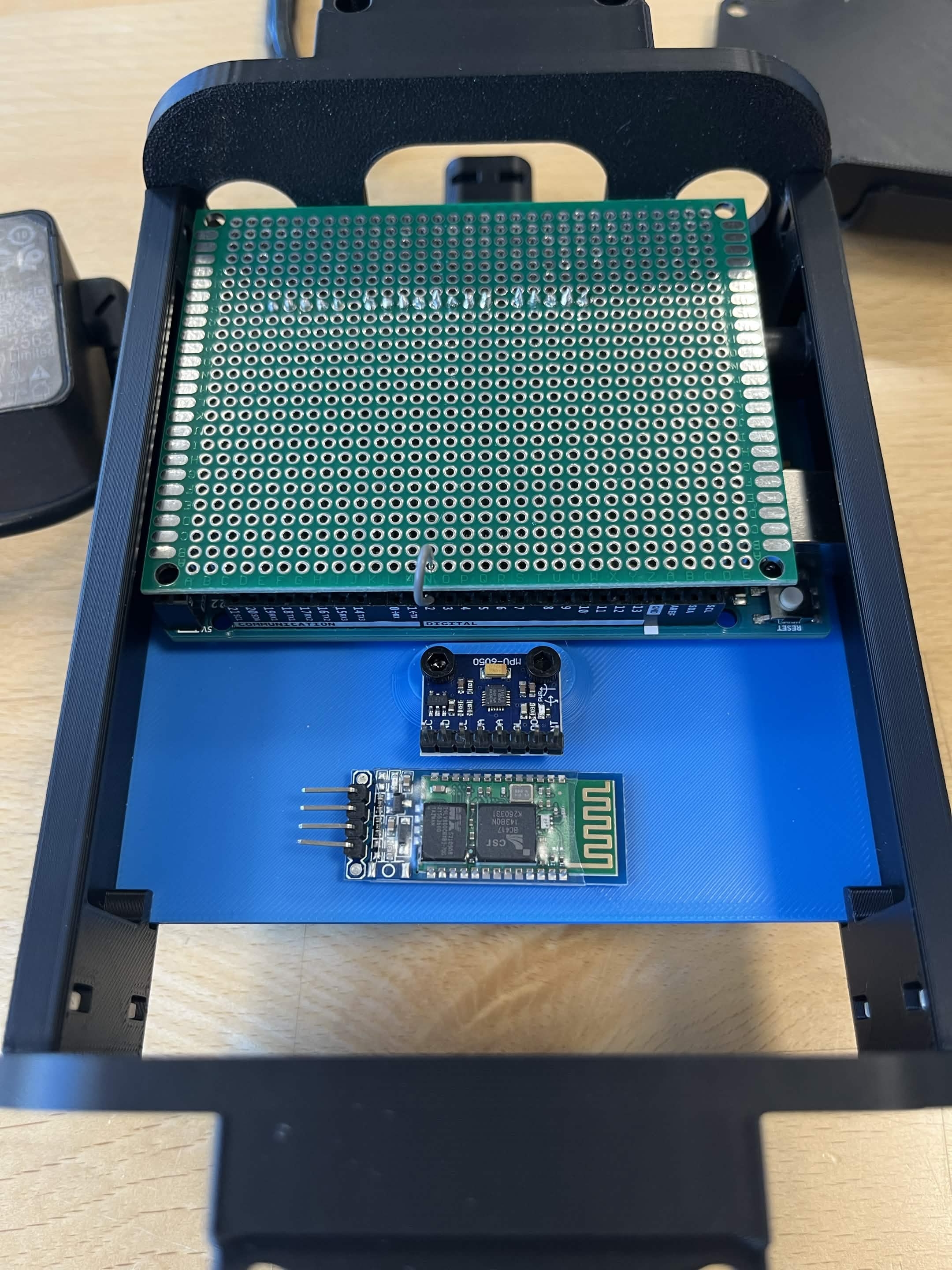 The PCB on top of the Arduino, the gyro, and the bluetooth module